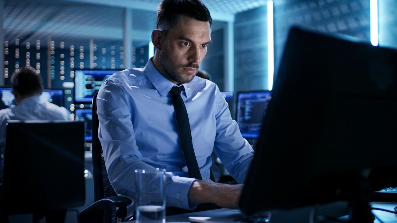 Professional investigator at high-tech monitoring station