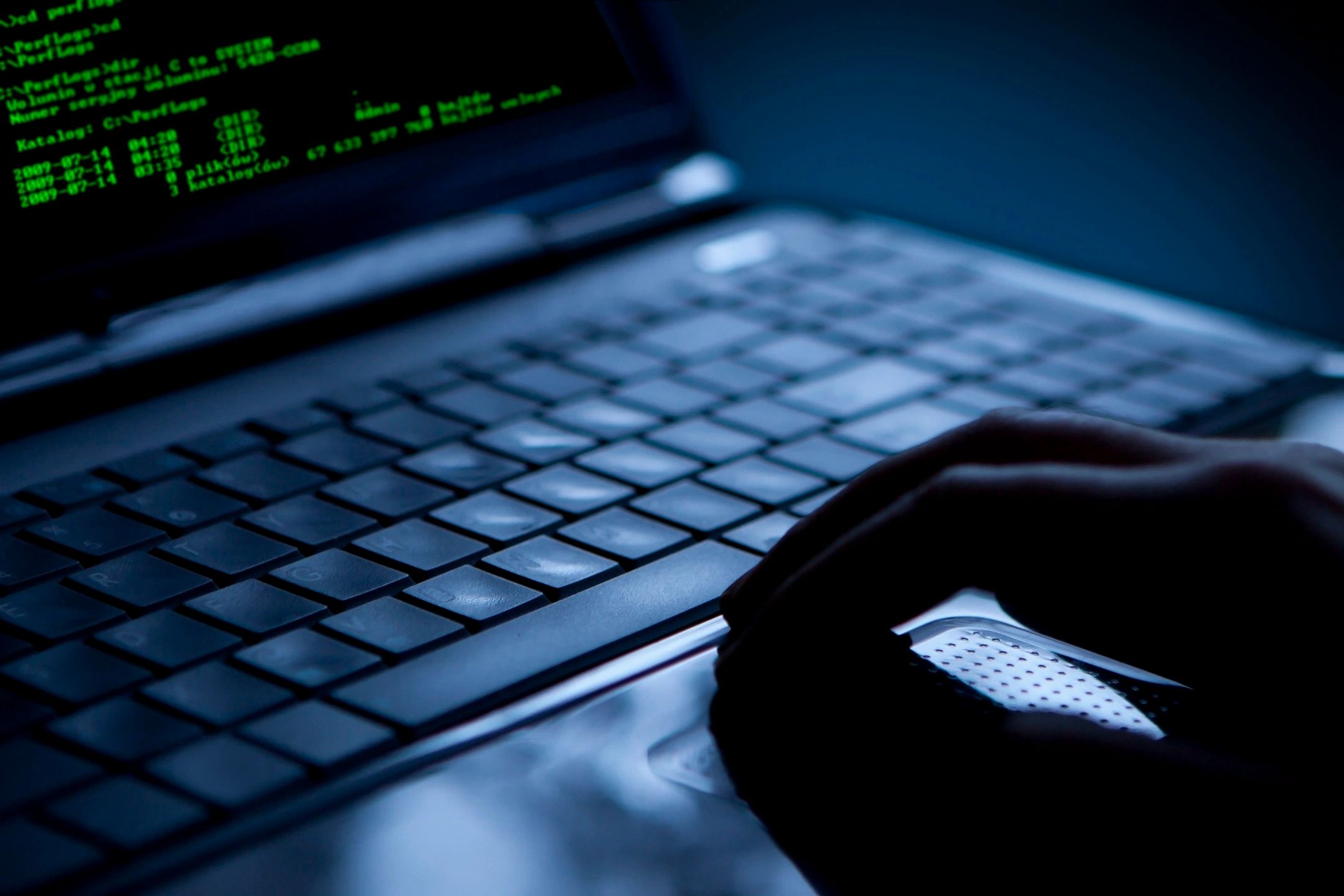 Cybersecurity investigation — laptop with terminal code